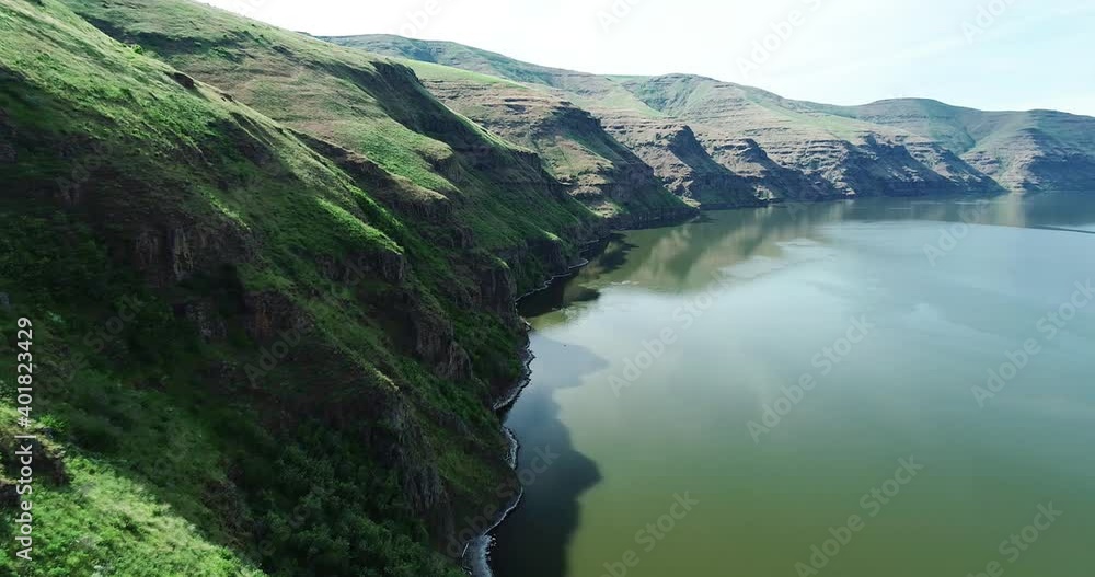 Drone shot. Flying west along Snake river. while on edge of cliff. Drone shot. Flying west along Snake river. while on edge of cliff.