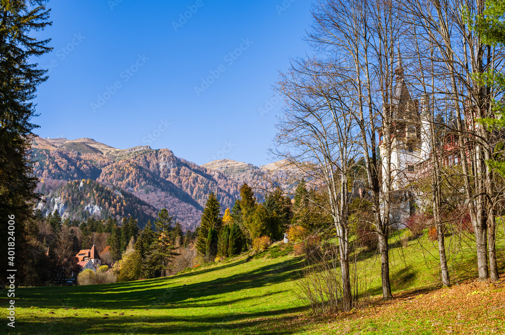 Peles and Pelisor Castle with Romanian Carpathian Mountains in the background