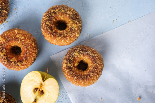 Homemade apple cider doughnuts from above on blue