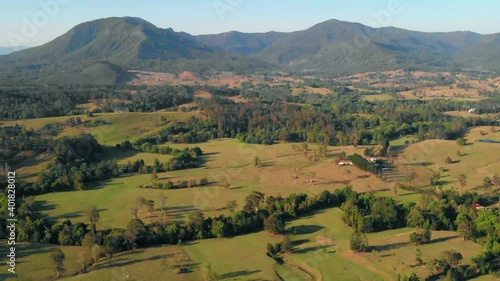 Aerial drone view over Nimbin nature, with a mountain background, in Australia photo