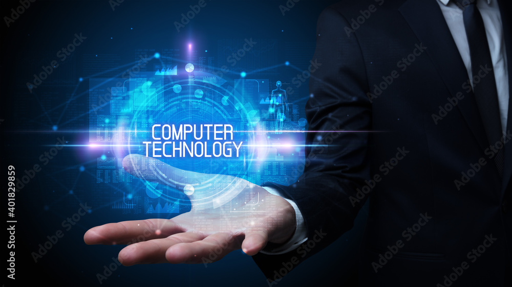 Man hand holding COMPUTER TECHNOLOGY inscription, technology concept Man hand holding COMPUTER TECHNOLOGY inscription, technology concept