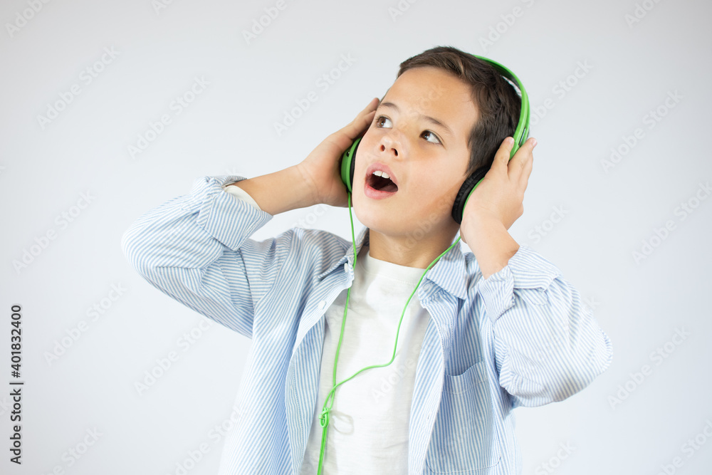 Happy teen beautiful boy with headphones, isolated on white background Happy teen beautiful boy with headphones, isolated on white background