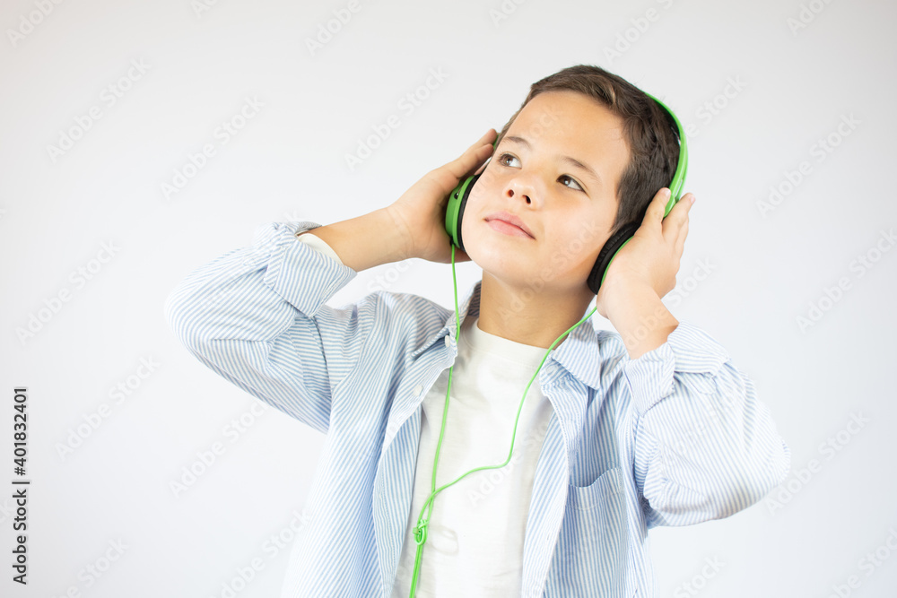 Happy teen beautiful boy with headphones, isolated on white background Happy teen beautiful boy with headphones, isolated on white background