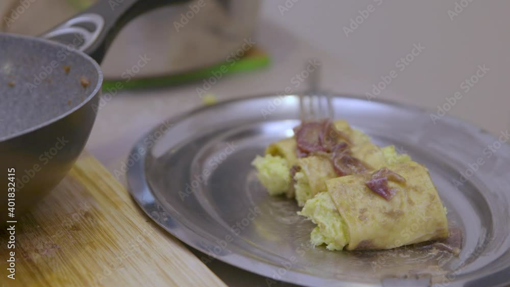 Cod paste is put into the homemade dough. The paste is wrapped in dough and cod rolls are formed. Cod paste is put into the homemade dough. The paste is wrapped in dough and cod rolls are formed.