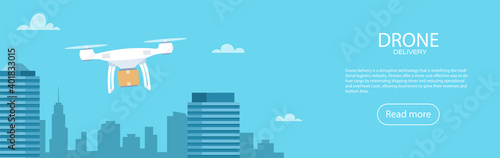 Delivery drone with the cardboard box flying over the town. Quadcopter carrying a package to customer. Technological shipment innovation. Drone delivery service.