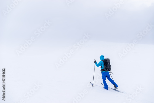Man on cross country skis in the mountains near Hovringen in Rondane National Park, Norway
