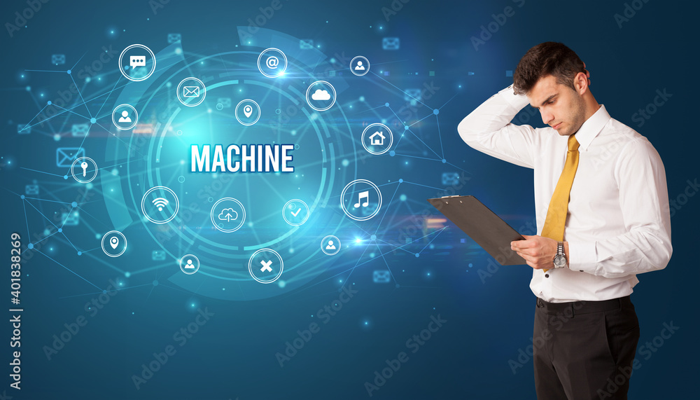 Businessman thinking in front of technology related icons and MACHINE inscription, modern technology concept Businessman thinking in front of technology related icons and MACHINE inscription, modern technology concept