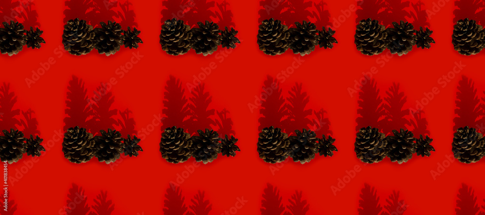 Pine cones on red background seamless pattern. Merry Christmas Creative New Year concept.
