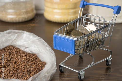 Obraz na plátne Kazakhstani tenge KZT in a grocery basket with bread, buckwheat grain and cereals