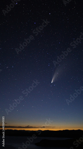 comet neowise falling through a star filled sky