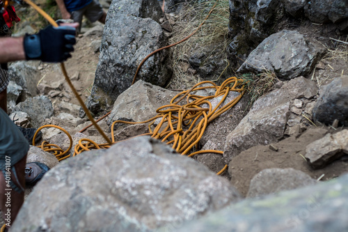 A closeup of a dynamic rope on the mountain rocks, mountaineering in Cercedilla, Spain photo
