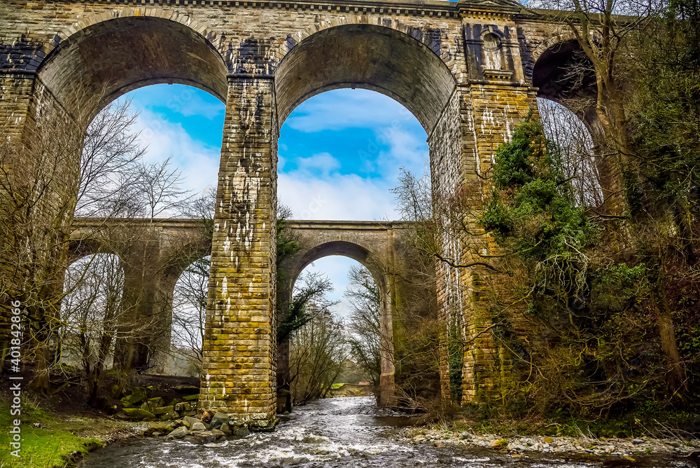 The River Ceiriog flowing through the aqueduct and the railway viaduct at Chirk, Wales