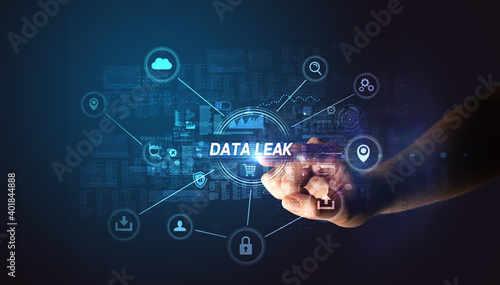Hand touching DATA LEAK inscription, Cybersecurity concept
