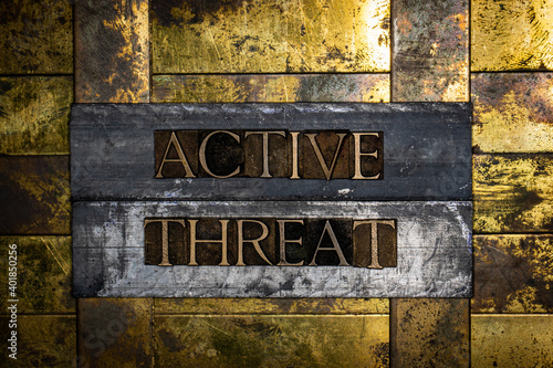 Active Threat text on grunge textured authentic copper and gold background