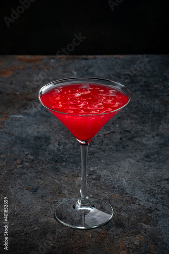 Classic cosmopolitan Cocktail on a dark stone background for the bar menu