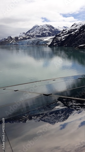Glacier Bay, Alaska US: View from the top deck of the cruise ship on the Margerie Glacier with a reflection on the glass surface