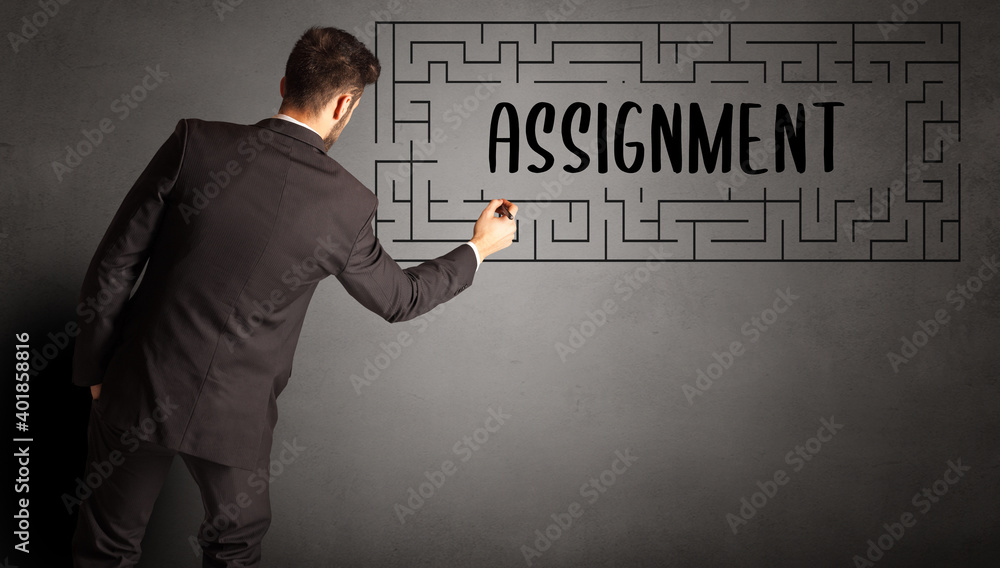 businessman drawing maze with ASSIGNMENT inscription, business education concept businessman drawing maze with ASSIGNMENT inscription, business education concept