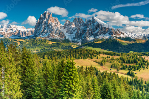 landscape with mountains trees and sky with beautiful clouds Alpe di Siusi Seiseralm