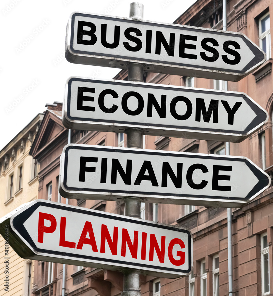 The road indicator on the arrows of which is written - business, economics, finance and PLANNING