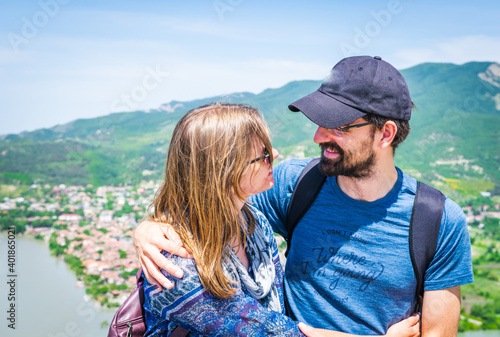 Close up of Male and female happy sit and enjoy travel together in beautiful scenic location © Evaldas