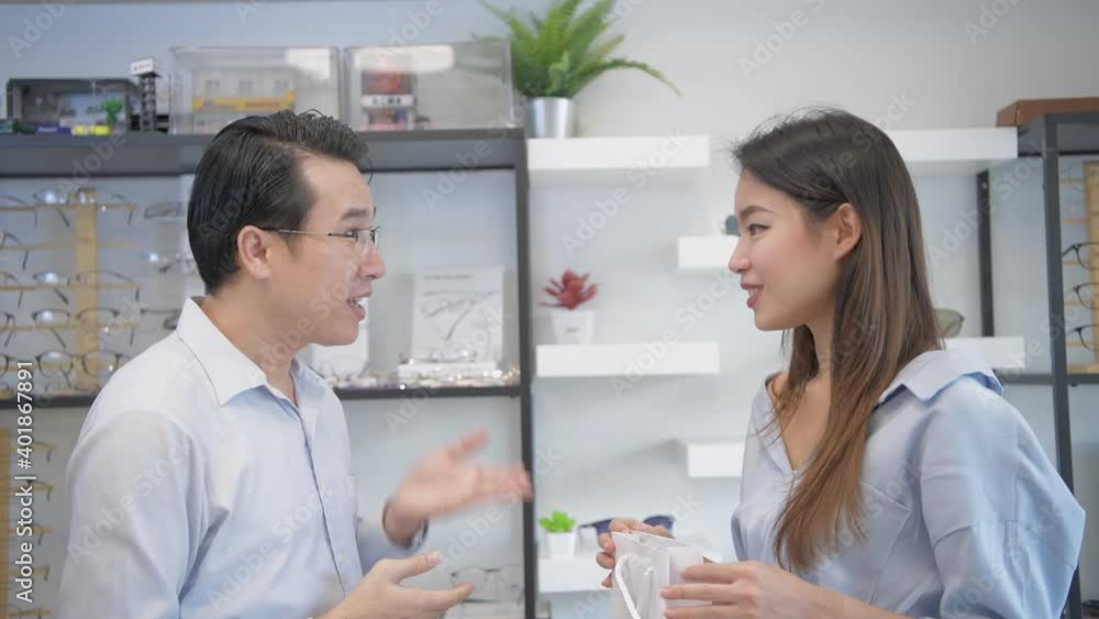 Optical shop concept of 4k Resolution. Asian employees are delivering products to customers. Optical shop concept of 4k Resolution. Asian employees are delivering products to customers.
