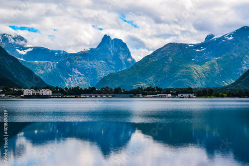 Beautiful landscape of mountains reflected in Romsdal Fjord or Romsdalsfjord in cloudy weather. More og Romsdal county. Norway. photo