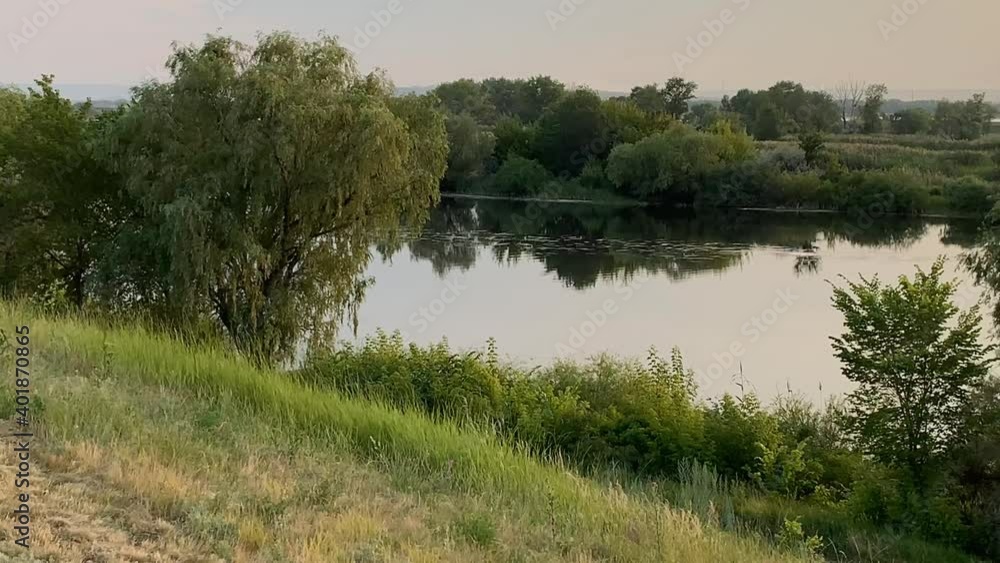 Evening landscape in summer at sunset by the river Evening landscape in summer at sunset by the river