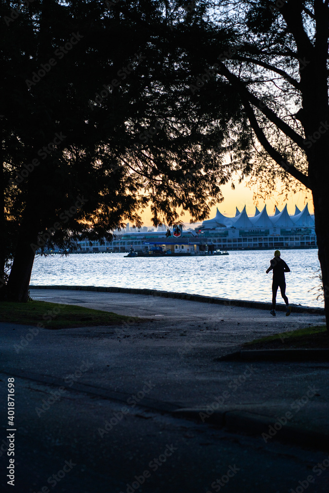 Runner on the Stanley Park Seawall in Vancouver Runner on the Stanley Park Seawall in Vancouver