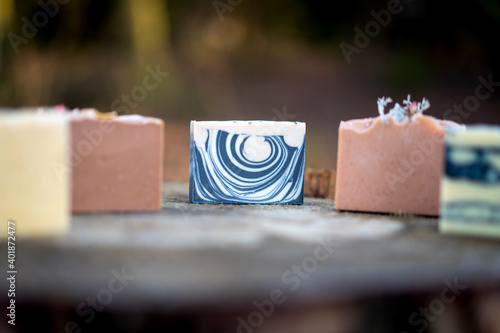 Fresh bar of natural handmade soap presented in the forest