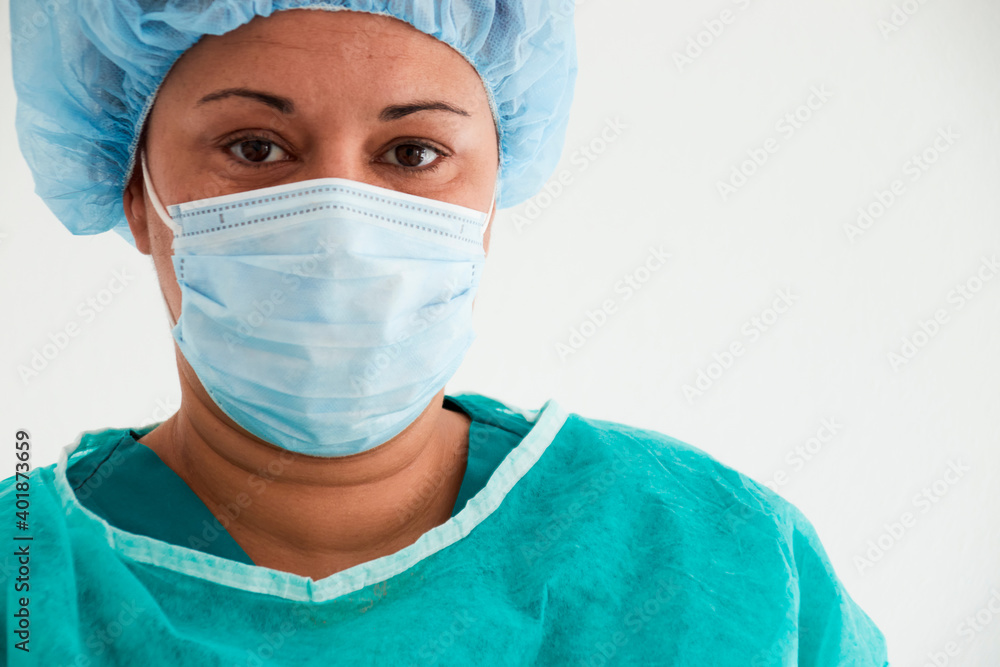 Nurse with uniform and mask facing the camera. Medical Concept. Nurse with uniform and mask facing the camera. Medical Concept.