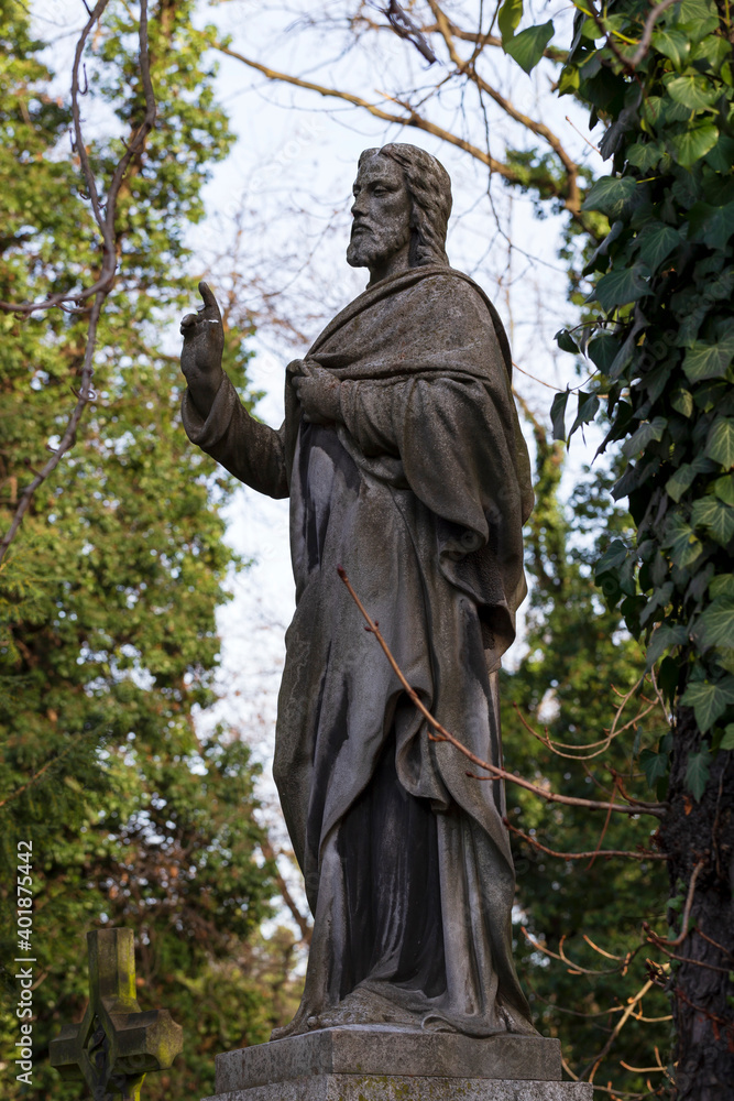 Historic Jesus on the winter mystery old Prague Cemetery, Czech Republic