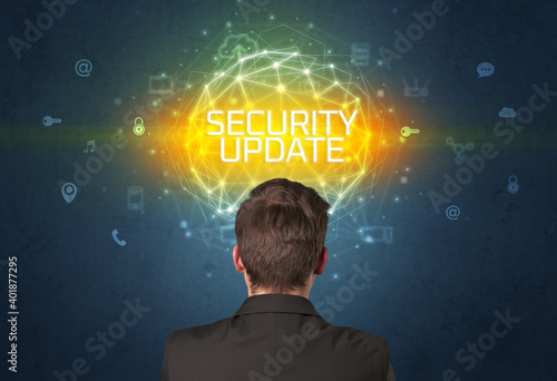 Rear view of a businessman with SECURITY UPDATE inscription, online security concept