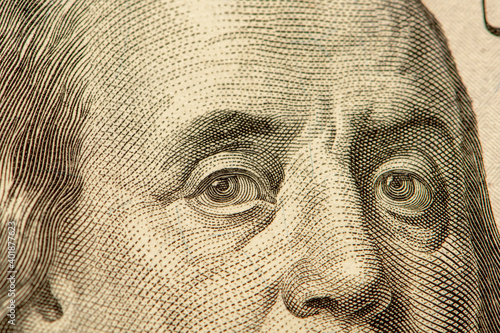 portrait of Franklin on a $ 100 bill, close-up, selective focus. Author of the aphorism "Time is money".