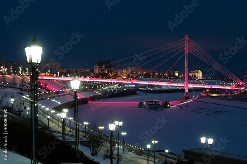 Pedestrian bridge on the embankment in Tyumen, Russia, at night, in winter