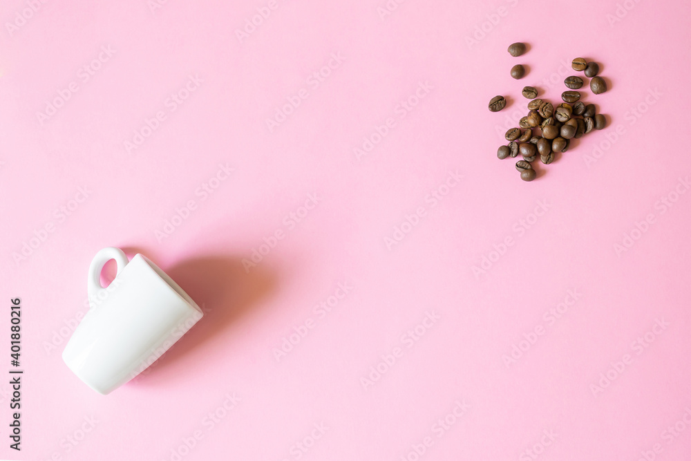 Coffee little cup and beans on pink background with copy space, morning concept