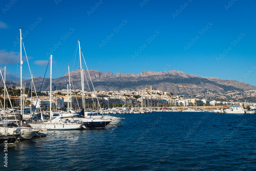 Yachts at the port of Altea with view on mountain range with old city and cathedral, Altea, Costa Blanca, Spain