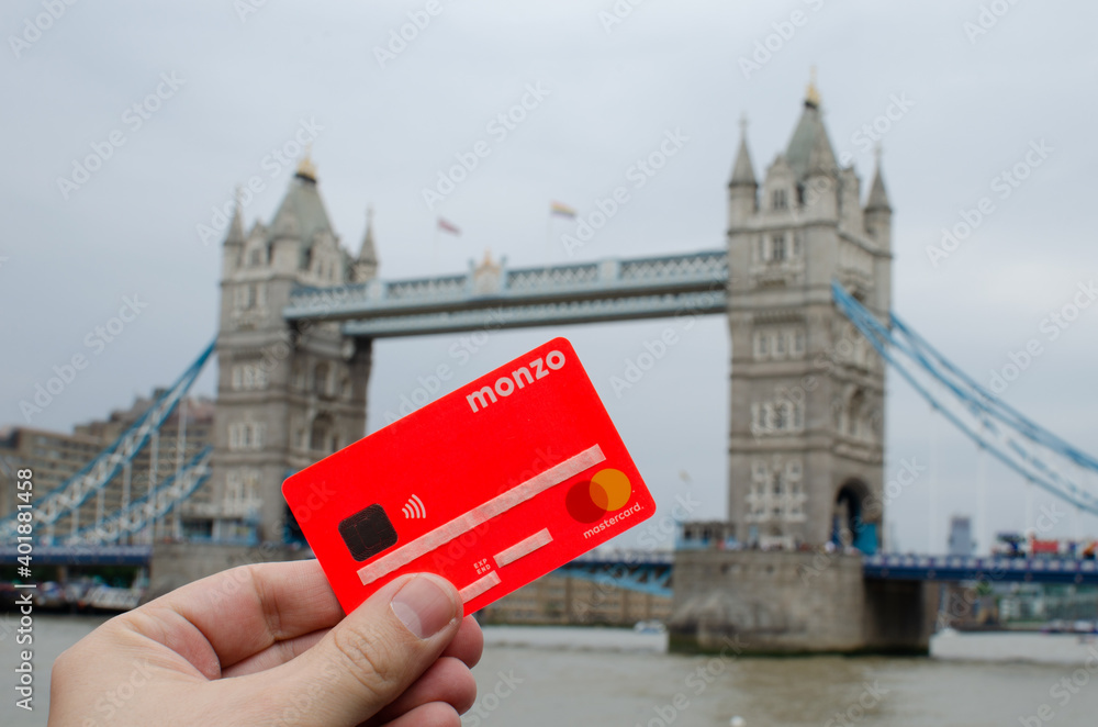 London / United Kingdom - July 6 2019: Monzo bank card hold in front of ...