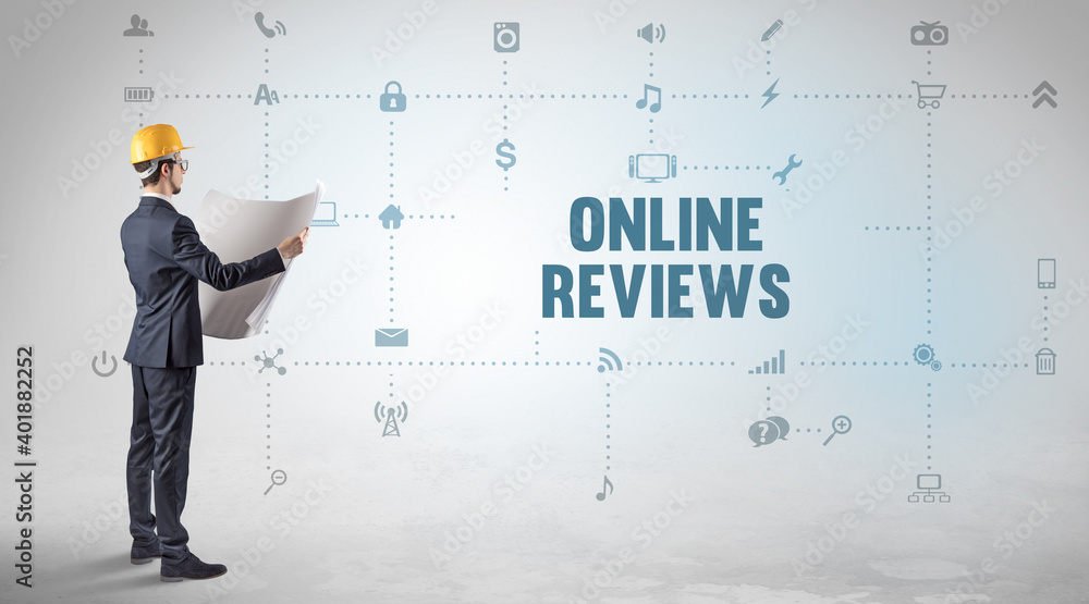 Engineer working on a new social media platform with ONLINE REVIEWS inscription concept Engineer working on a new social media platform with ONLINE REVIEWS inscription concept