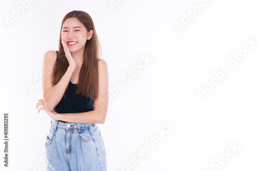 Cheerful smile young women wear t-shirt and jeans holding hand on her head while think good ideas something over isolated white background. Lifestyle concept.