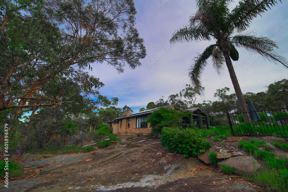 Residential house in Dural a country suburb in Sydney NSW Australia with lush green trees and grass Residential house in Dural a country suburb in Sydney NSW Australia with lush green trees and grass