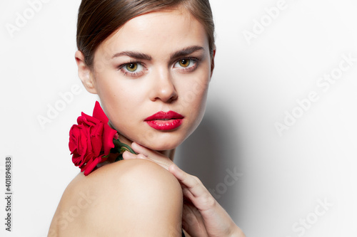 Woman with rose Red lips nude model shoulders luxury light 