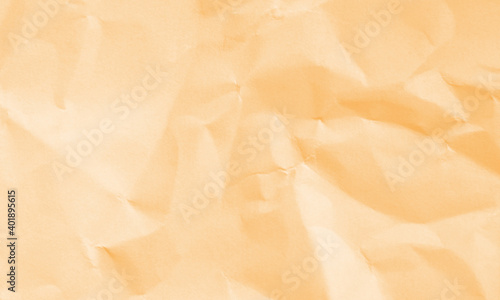 light orange colored crumpled paper texture background for design, decorative.