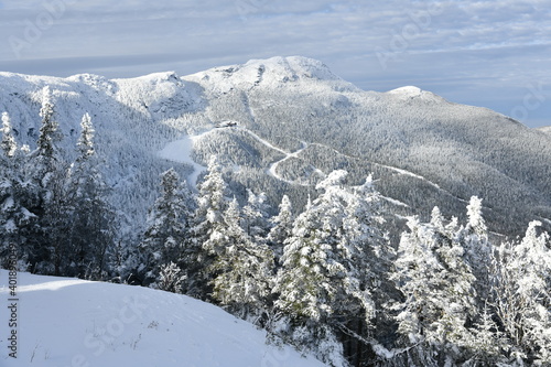 Stowe Ski Resort in Vermont, view to the Mansfield mountain slopes, December fresh snow on trees early season in VT, panoramic hi-resolution image photo