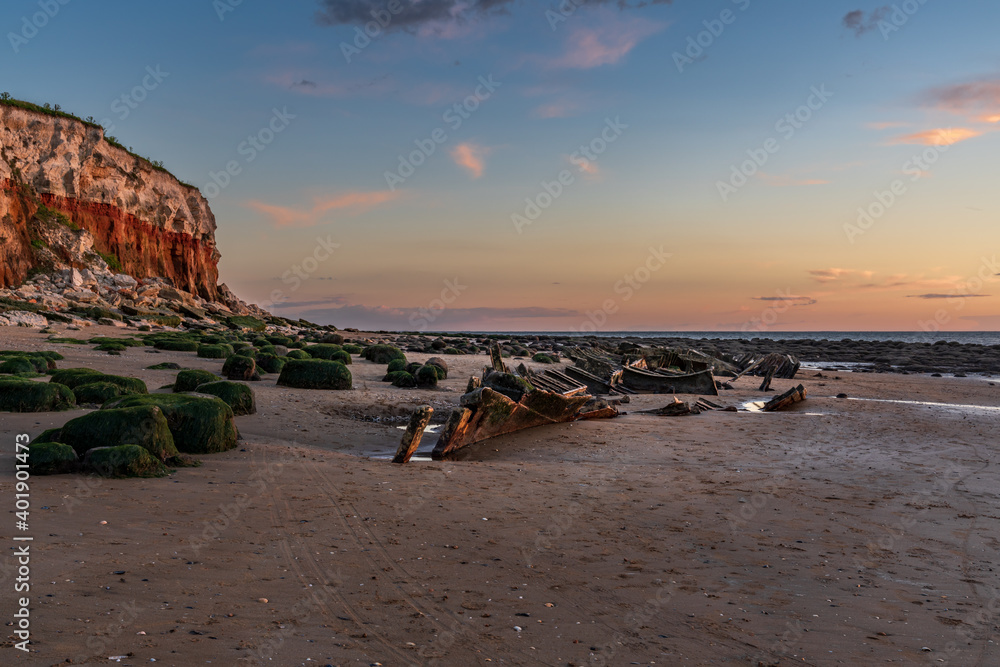 The Wreck of the Steam Trawler Sheraton in the evening light at the Hunstanton Cliffs in Norfolk, England, UK The Wreck of the Steam Trawler Sheraton in the evening light at the Hunstanton Cliffs in Norfolk, England, UK