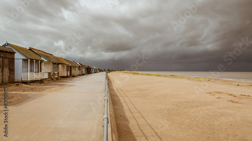 Grey clouds over the Beach Huts in Sandilands, Lincolnshire, England, UK photo