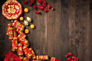 The Chinese new year festival, Top view flat lay happy Chinese new year or lunar new year decorations celebration with copy space on wood background (Chinese character "fu" meaning fortune good luck)