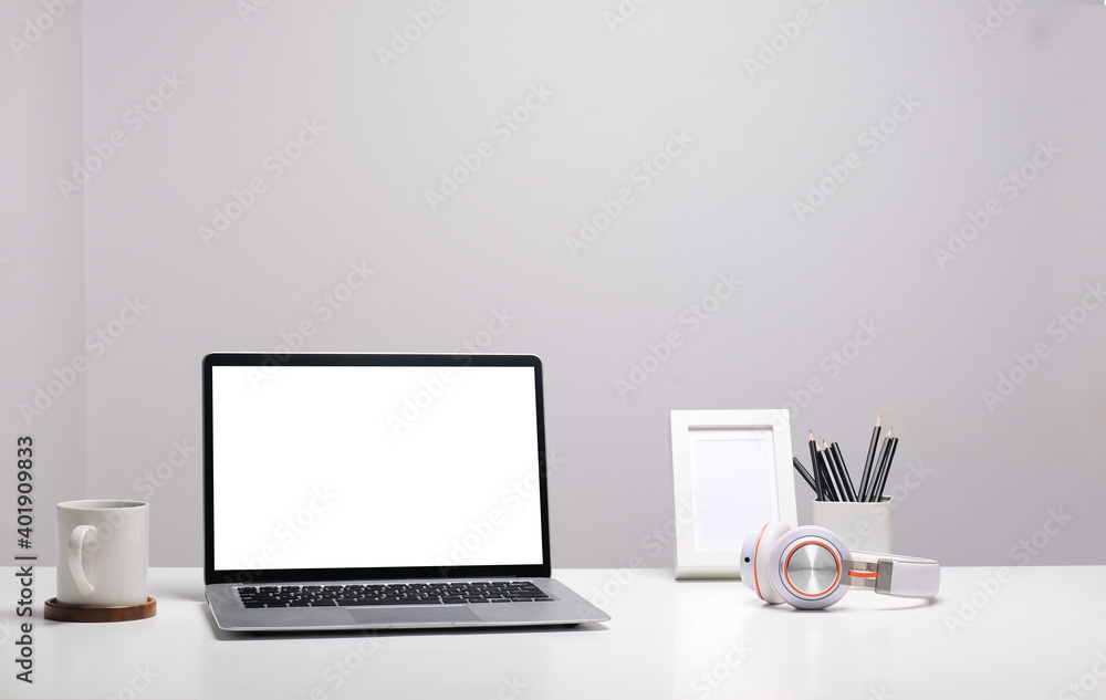 Modern workspace with computer with blank screen and equipment on white table.Blank screen for your information. Modern workspace with computer with blank screen and equipment on white table.Blank screen for your information.