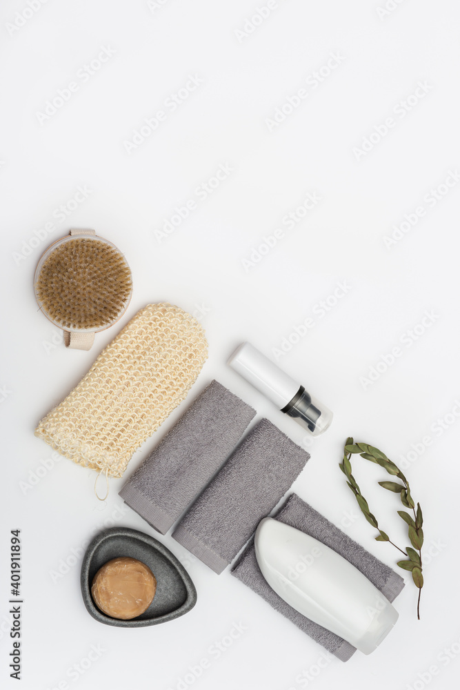 Spa still life background. Set for body care on white. Bottles with gel or shampoo, soap, wooden comb, washcloth for bath. Spa still life background. Set for body care on white. Bottles with gel or shampoo, soap, wooden comb, washcloth for bath.