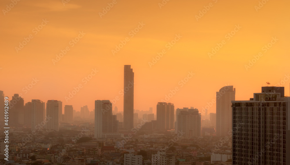 Air pollution in Bangkok, Thailand. Smog and fine dust of pm2.5 covered city in the morning with orange sunrise sky. Cityscape with polluted air. Dirty environment. Urban toxic dust. Unhealthy air. Air pollution in Bangkok, Thailand. Smog and fine dust of pm2.5 covered city in the morning with orange sunrise sky. Cityscape with polluted air. Dirty environment. Urban toxic dust. Unhealthy air.