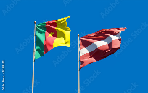 Flags of Latvia and Cameroon.
